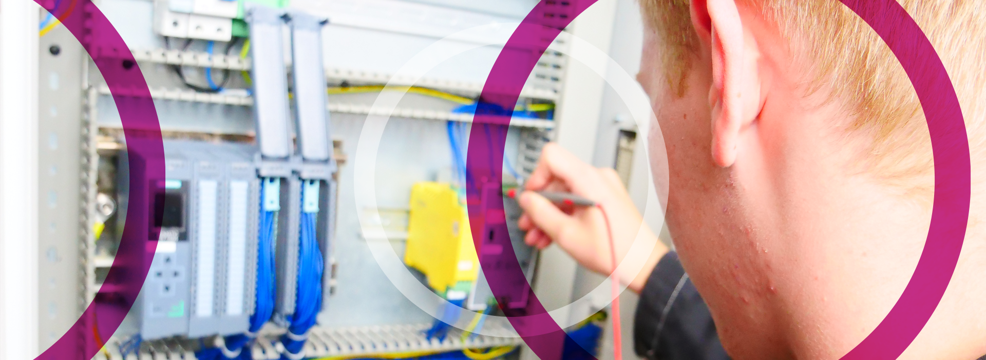 Electrical staff testing connections in electrical board
